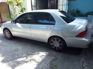 Mitsubishi Lancer 2003  bolsas de aire buenas, color gris, automatico. Rines especiales R-15, Aire acondicionado, Vidrios eléctricos, espejos retrovisores eléctricos.