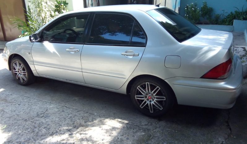 Mitsubishi Lancer 2003  bolsas de aire buenas, color gris, automatico. Rines especiales R-15, Aire acondicionado, Vidrios eléctricos, espejos retrovisores eléctricos.